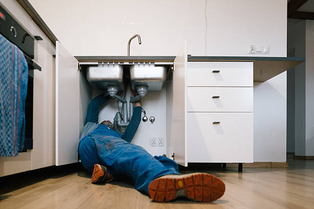 Professional Emergency Plumber technician working in Ball Ground, GA